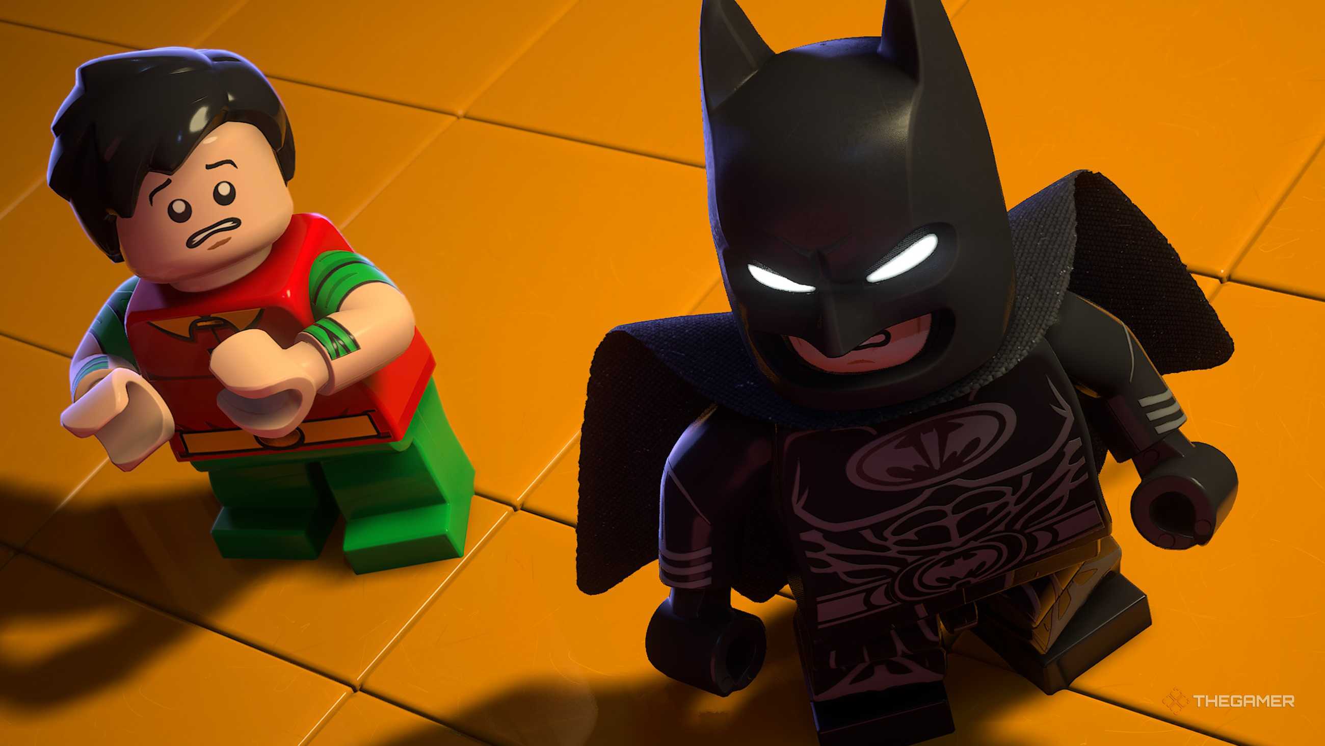 Batman and Robin stand on the yellow floor in the LEGO Batman Legacy of the Dark Knight.
