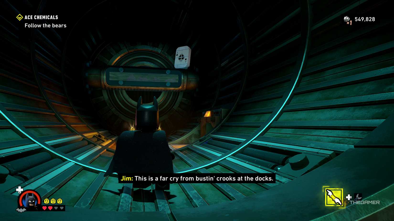 Batman looking at the ace card on a pipe from LEGO Batman: The Dark Knight Legacy.