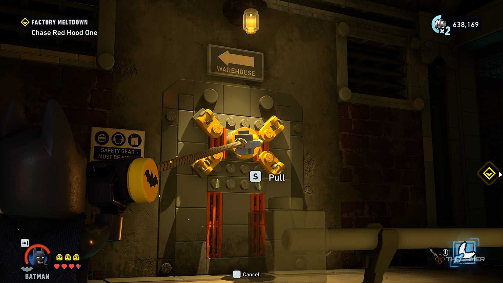 In LEGO Batman: The Dark Knight Legacy, Batman is pulling a door with a claw.