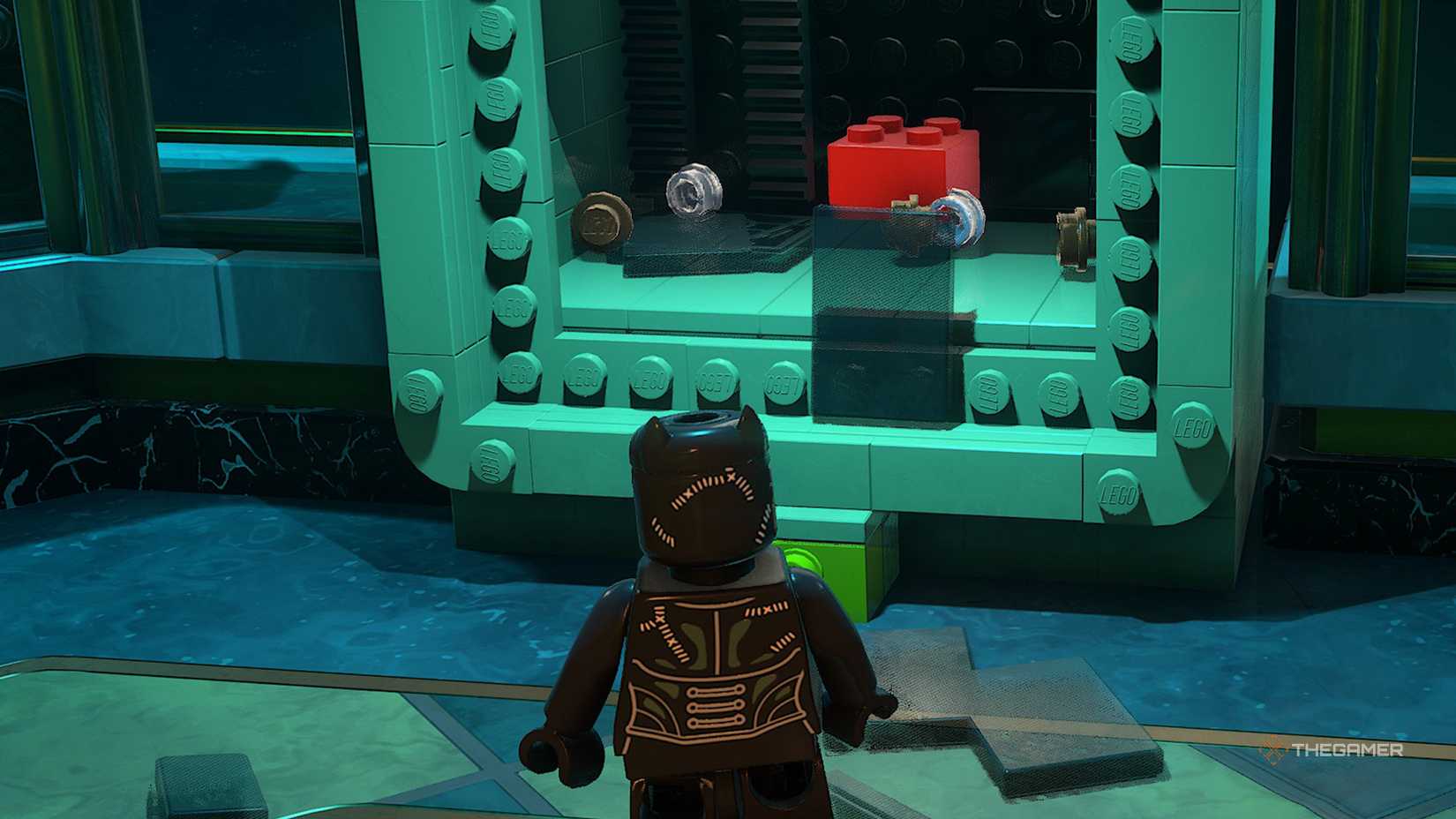 Catwoman looks at a red brick in a cabinet in Lego Batman Legacy of the Dark Knight.