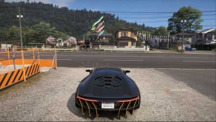 A Lamborghini Centenario LP 770-4 parked in a driveway with an image of a stunning Japanese village and forests in the distance in Forza Horizon 6.