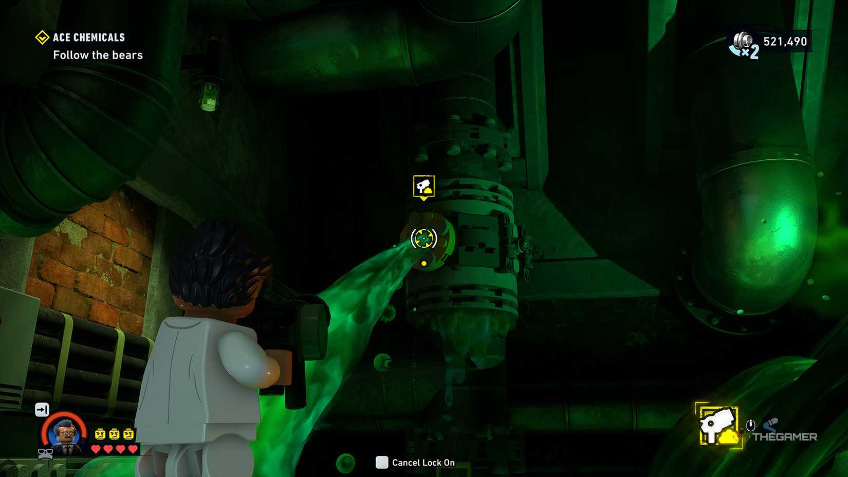 Jim Gordon aims a foam gun at a burst pipe in LEGO Batman Legacy of the Dark Knight.