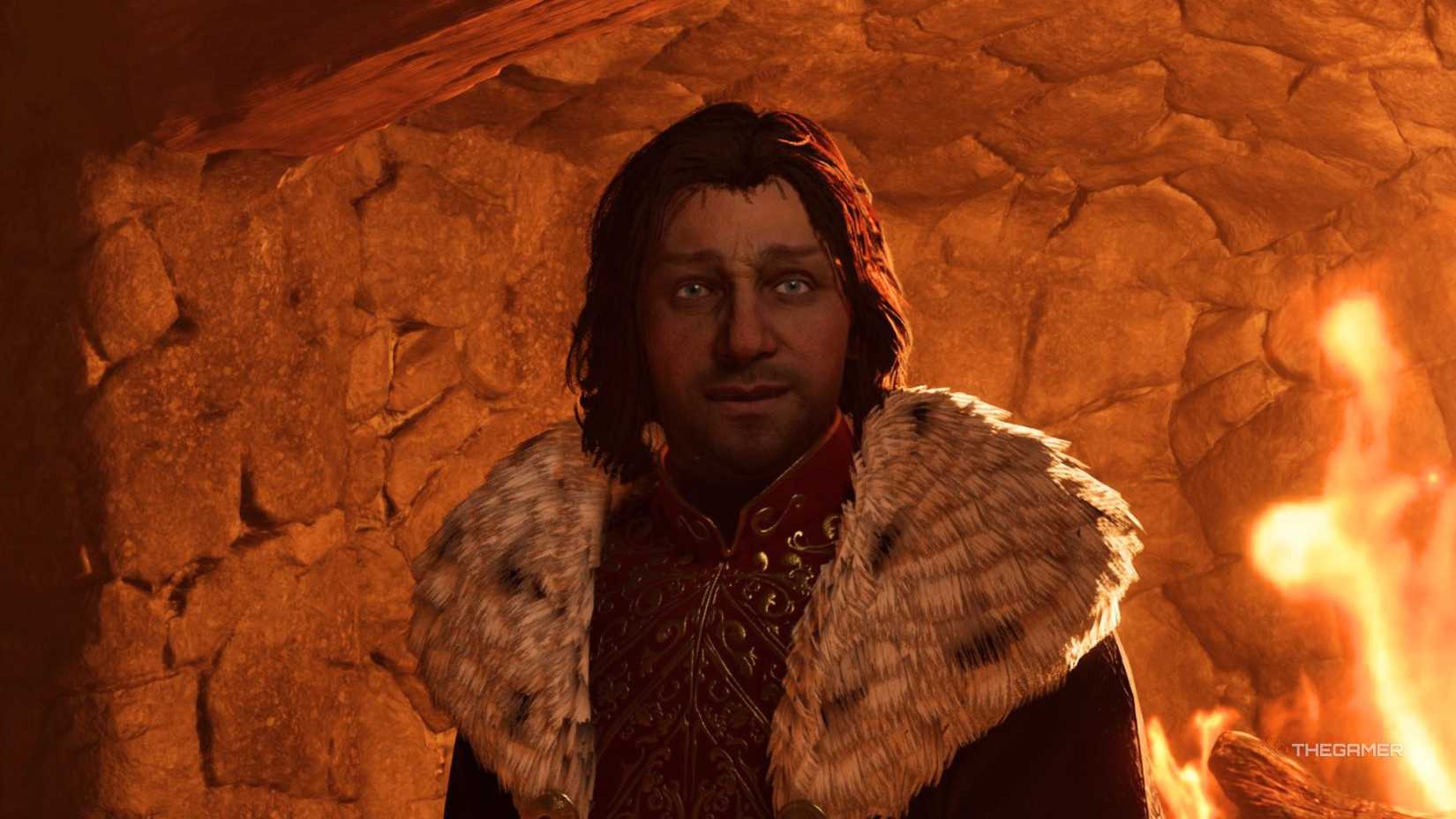 Martin Septim in Oblivion Remastered. He is wearing purple and red robes, and standing in front of a fire place.