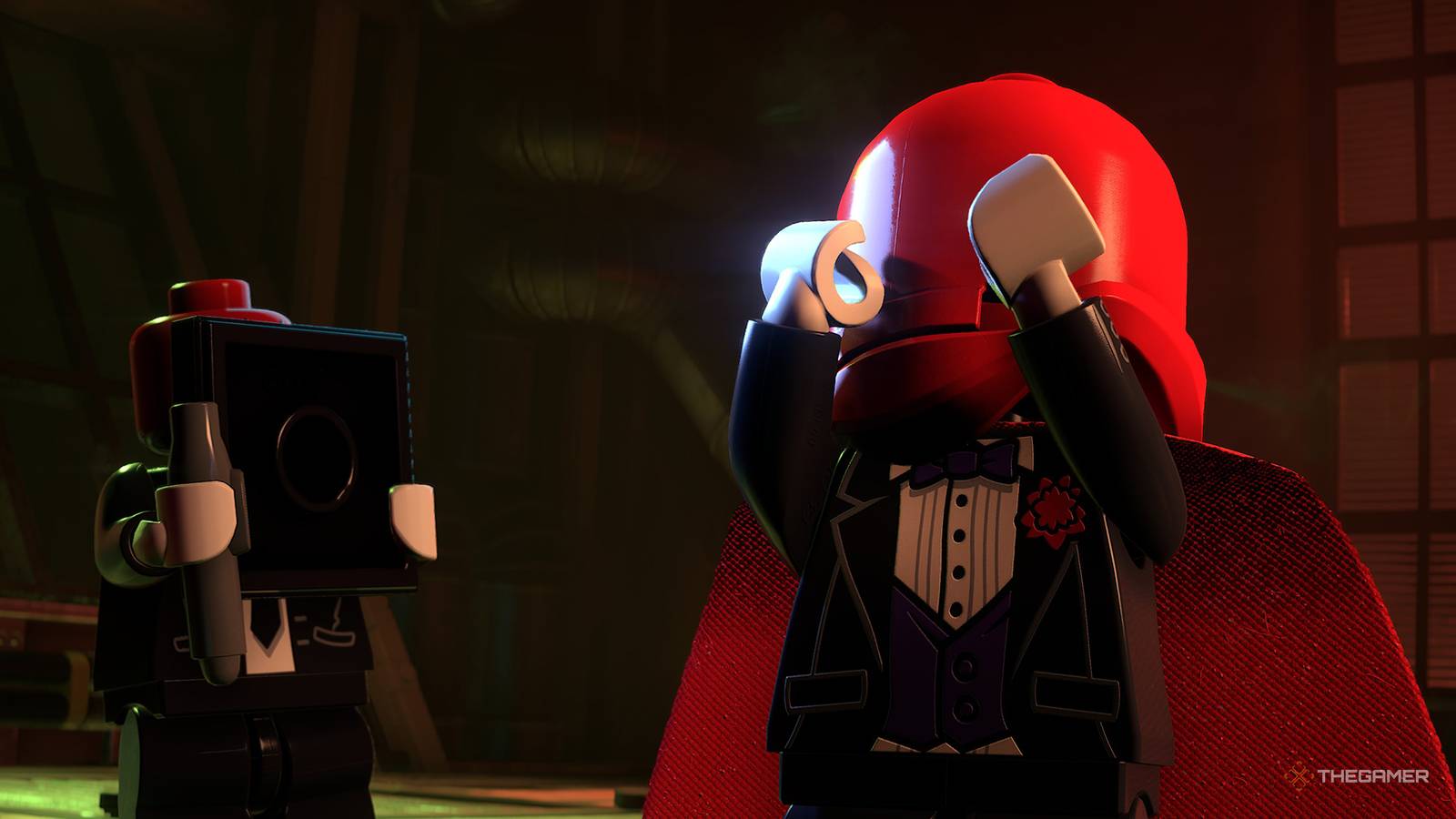 Red Hood One holding his mask from LEGO Batman: The Dark Knight Legacy.