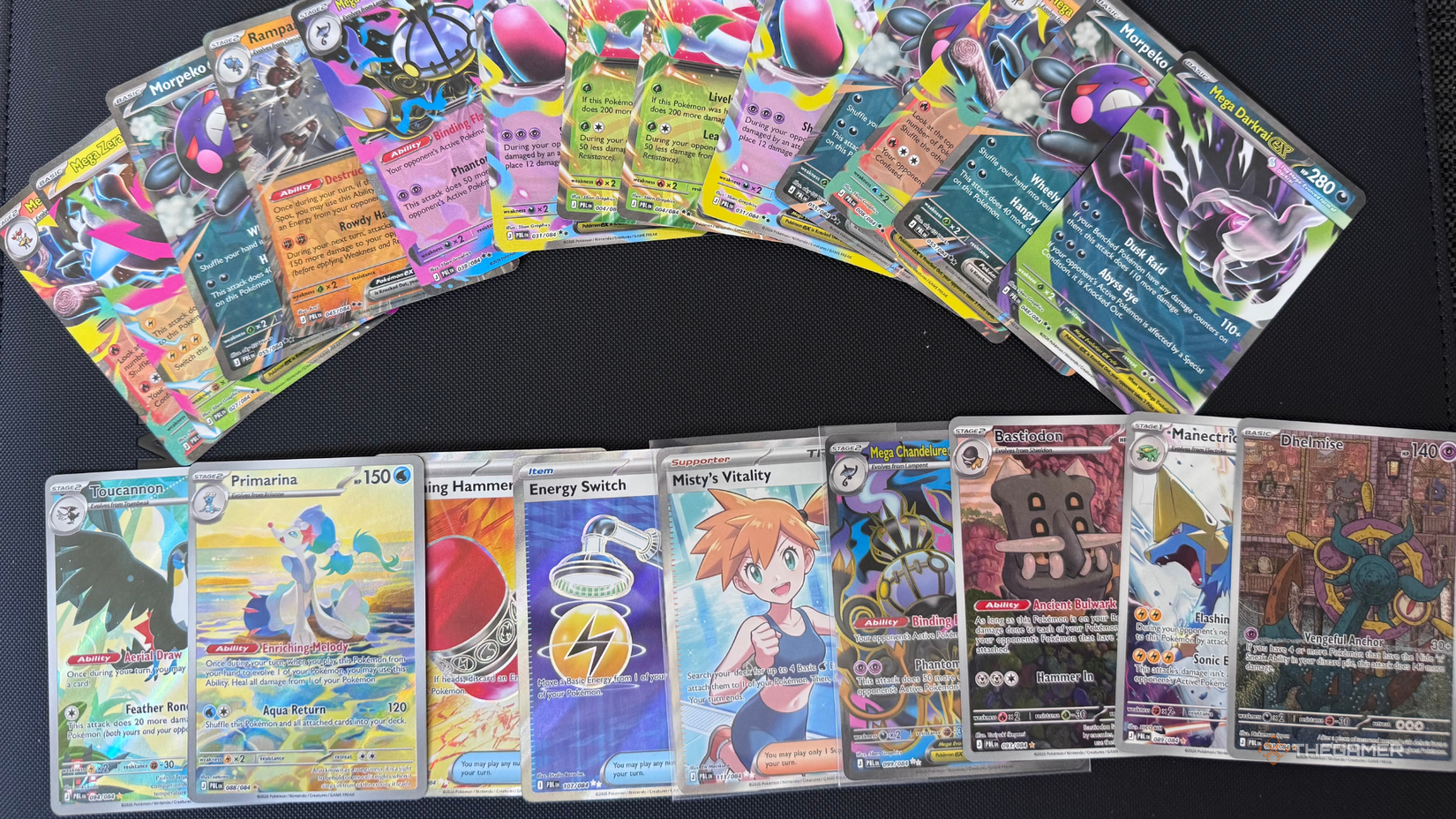 A photo of a selection of pokemon tcg pitch black pulls.
