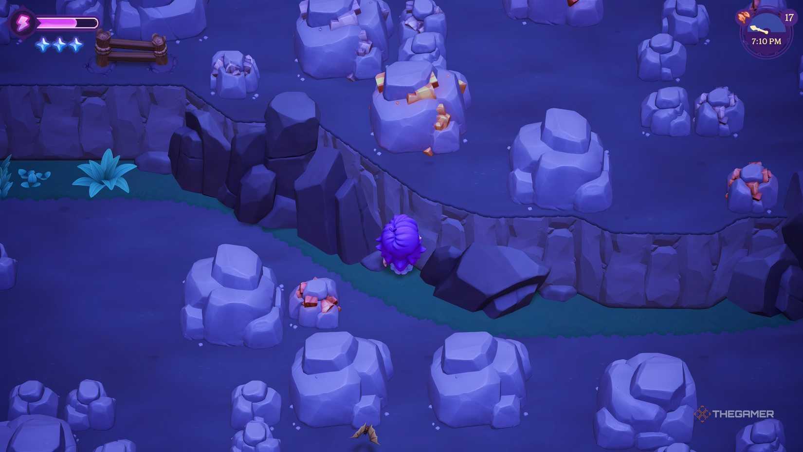 Player looking up at a Gold deposit in a cave in Moonlight Peaks.