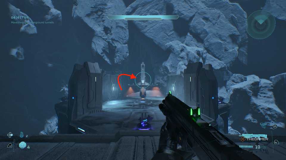An arrow pointing at a doorway on the other side of a snowy canyon in Halo Campaign Evolved.