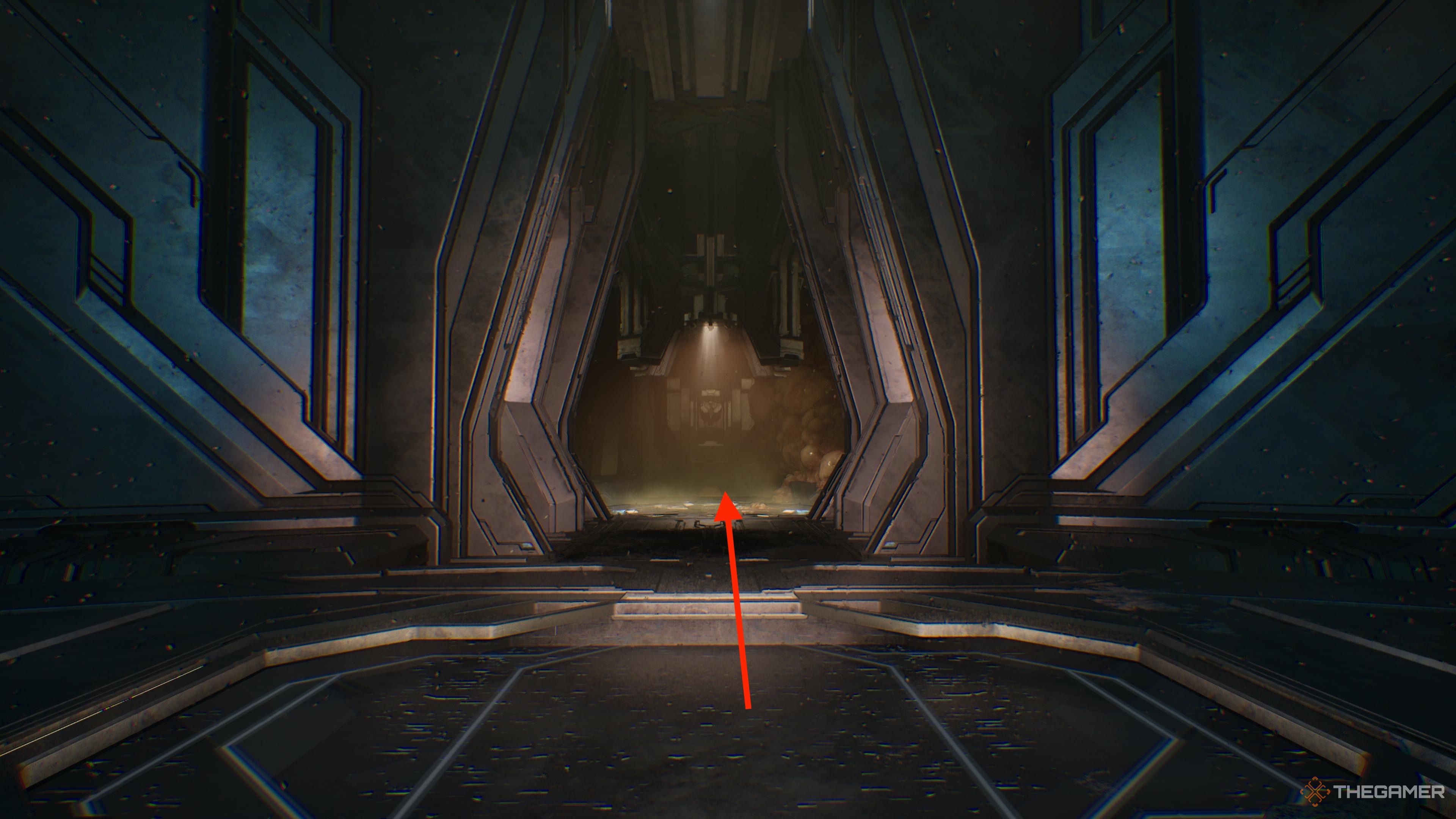 An arrow pointing through a narrow doorway in Halo Campaign Evolved.