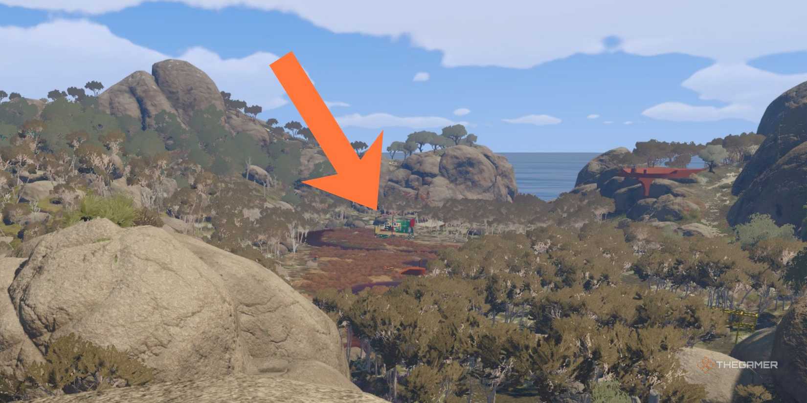 Freccia arancione che indica il Salon per personalizzare l'aspetto in Big Walk, con vista sulla zona Outback fuori dal hub di partenza