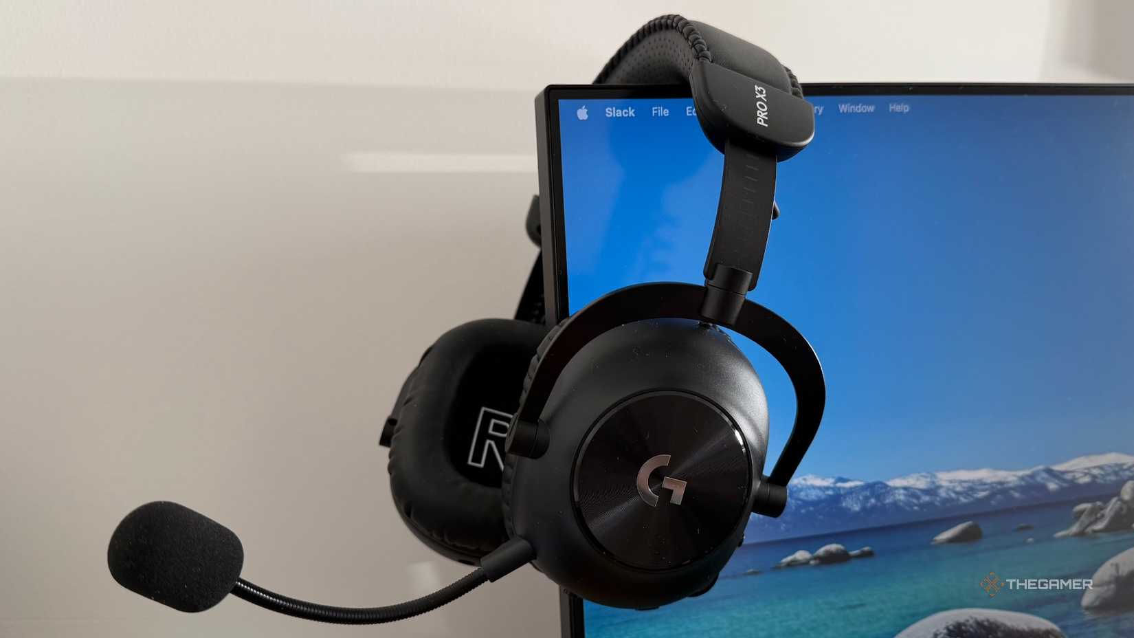 An image of the Logitach Pro X3 Lightspeed draped over a computer monitor.