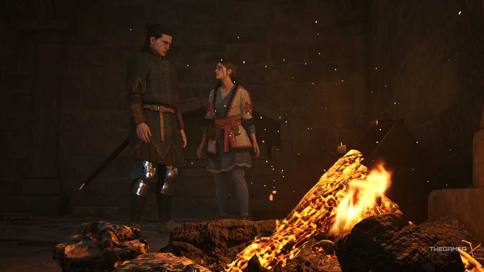 Coen and Anca standing by a fire in The Blood of Dawnwalker.