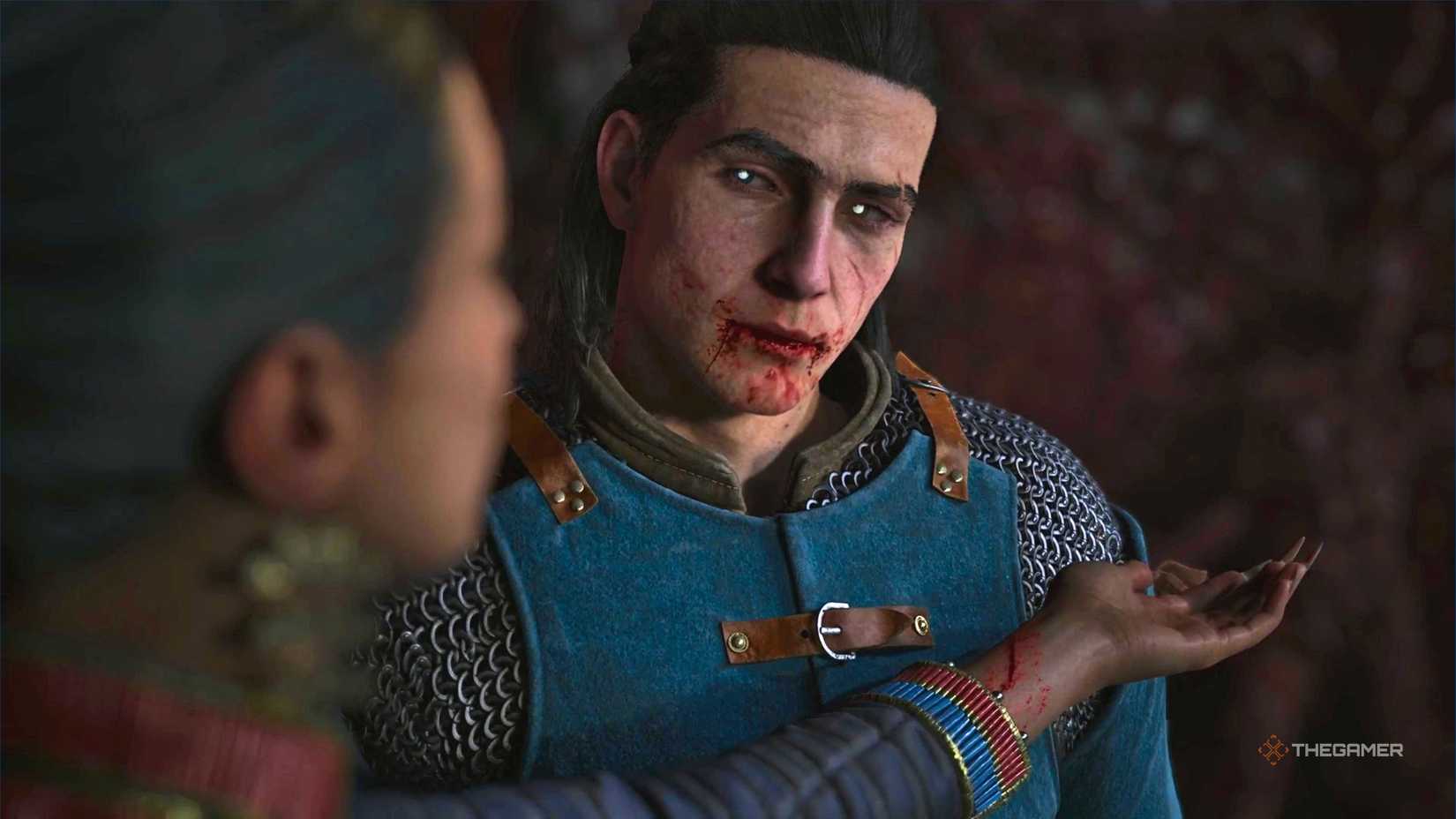 Coen looking at Lacra while she places her wrist in front of him in The Blood of Dawnwalker.