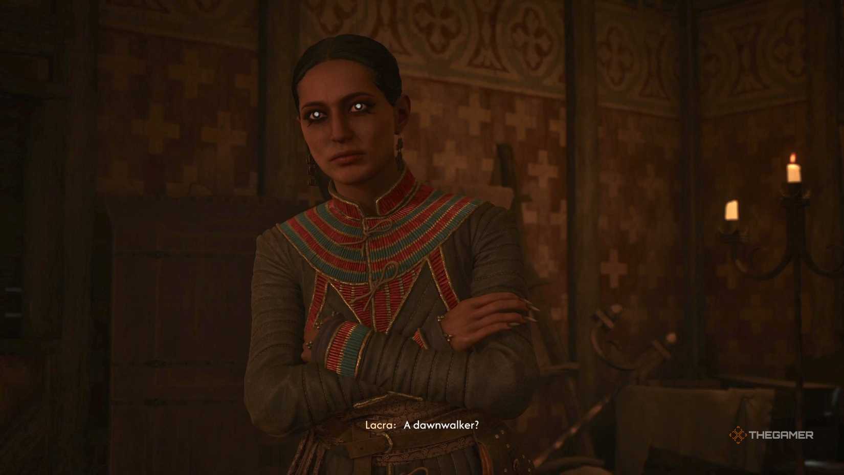 Lacra with her arms crossed in The Blood of Dawnwalker.