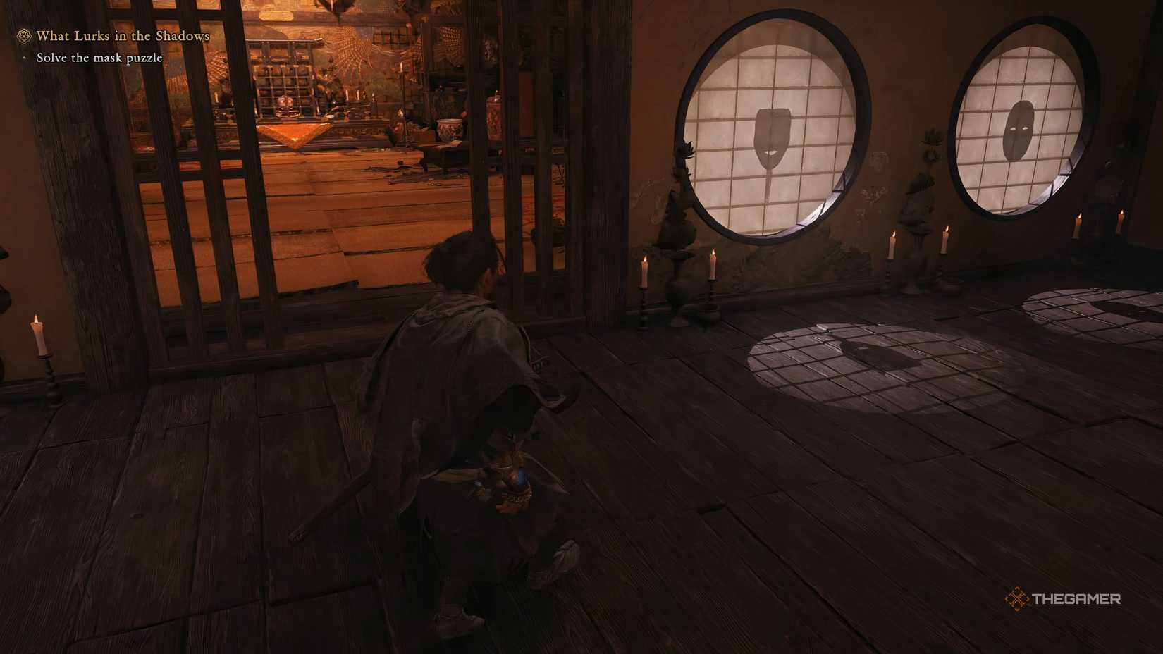 Musashi from Onimusha Way Of The Sword is looking at the mask shadows in the mask puzzle room.