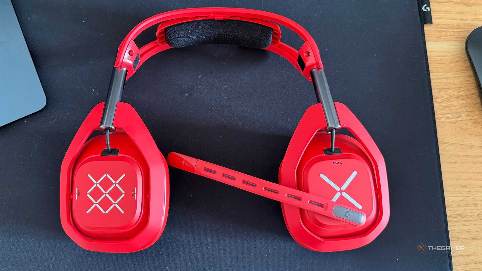 An image of the Astro A50 X in Red, positioned to show off the earcups and microphone.