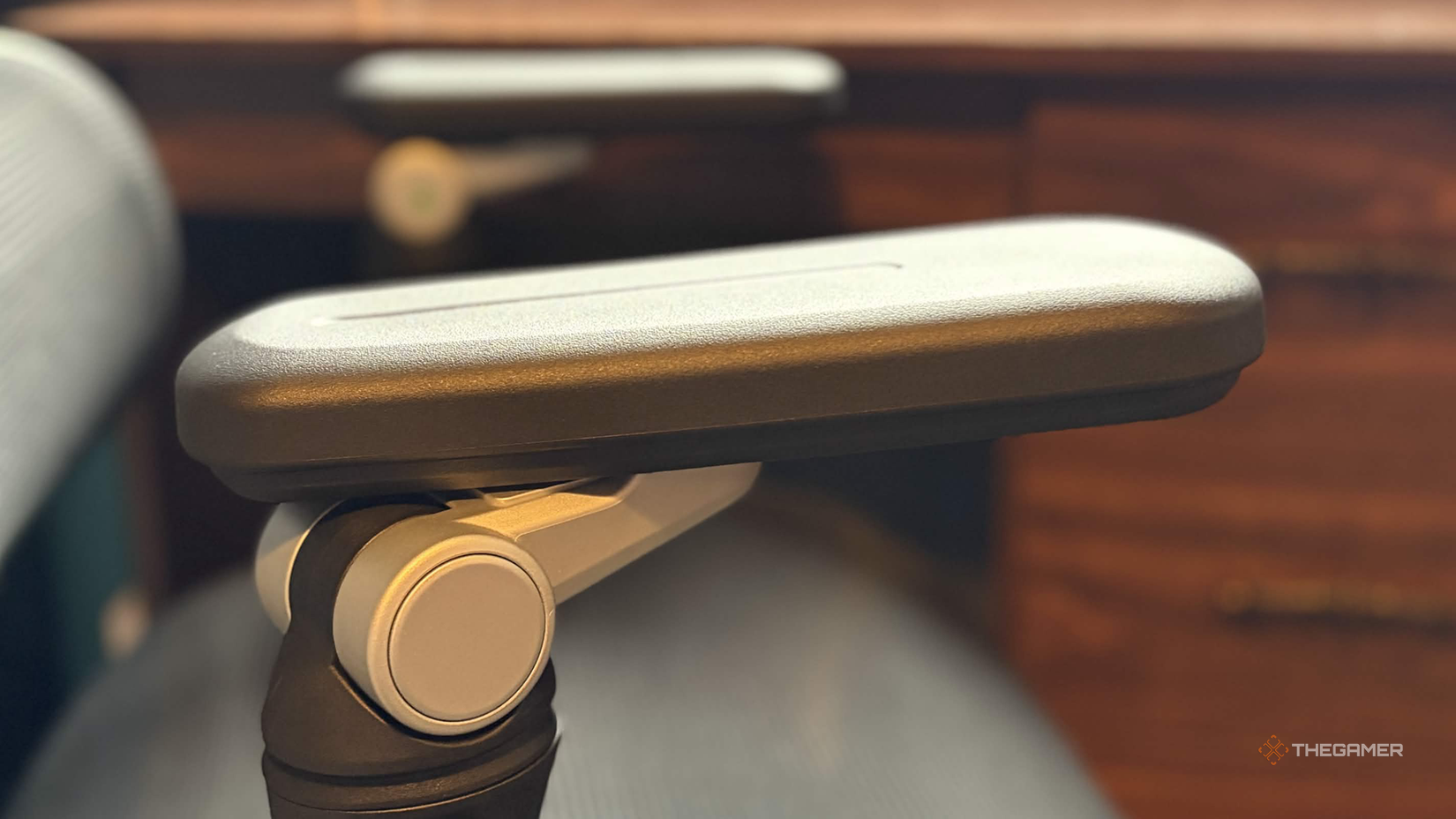 Boulies EP60 Chair Armrest in front of a brown desk.